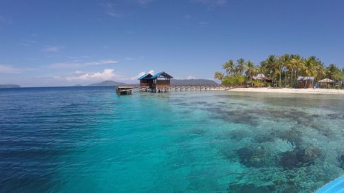 Scenic view of sea against blue sky