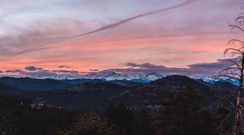 Scenic view of mountains against romantic sky at sunset