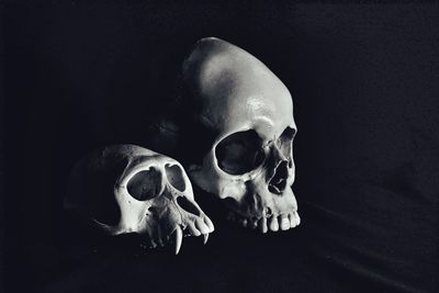 Close-up of human hand against black background