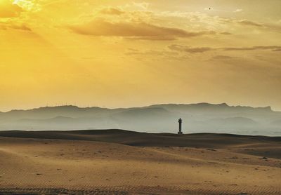 Scenic view of landscape at sunset