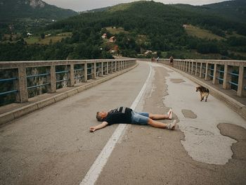 Woman standing on road