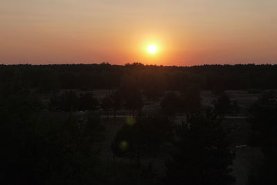 Scenic view of silhouette landscape against sky during sunset