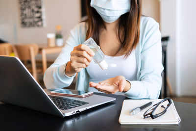 Businesswoman working at table