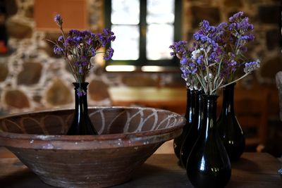 Close-up of purple flowers in vase on table