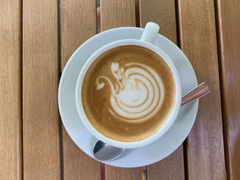Directly above shot of cappuccino served on table
