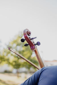 Midsection of woman playing violin