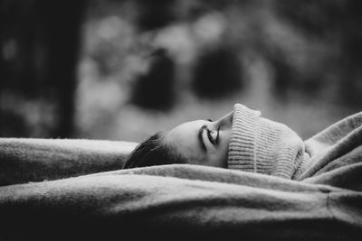 Close-up of woman sleeping on blanket