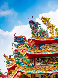 Chinese dragon and swan statues adorned the rooftops of pavilions in chinese religious venues