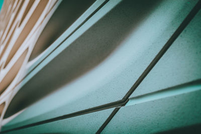 High angle view of railing and shadow on wall