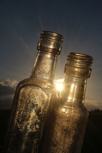 Close-up of old machine on table against sky