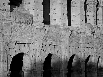 Full frame shot of old weathered wall of coliseum in rome