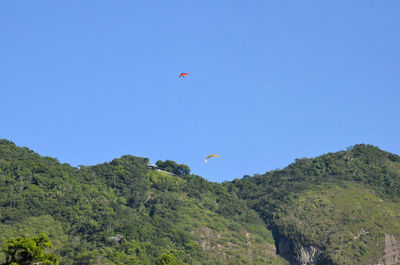 Scenic view of mountains against clear blue sky