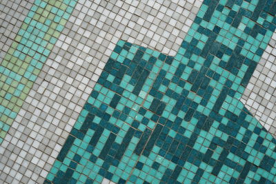 Full frame shot of tiled floor by swimming pool