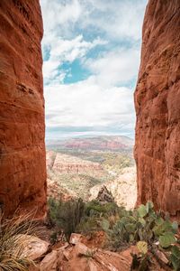 Scenic view of landscape against cloudy sky