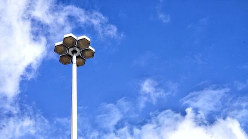 Low angle view of street light against blue sky