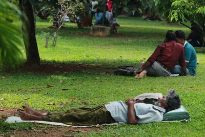 Full length of man relaxing in park