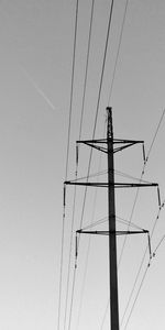 Low angle view of electricity pylon against sky