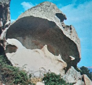 Low angle view of rocks against sky