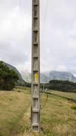 Built structure on field against sky