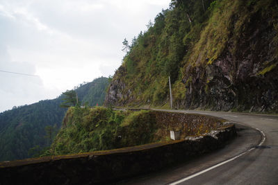 Scenic view of mountain road against sky