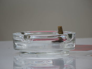 Close-up of ashtray on table