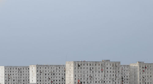 Low angle view of buildings against clear sky