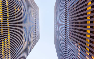 Directly below shot of modern buildings against sky