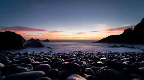 Scenic view of sea against sky during sunset