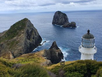 Panoramic view of rocks on shore against sky