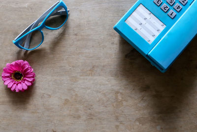High angle view of pink flower on table