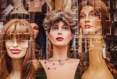 Close-up of mannequins in display at store