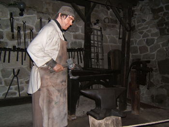 Side view of man working on seat