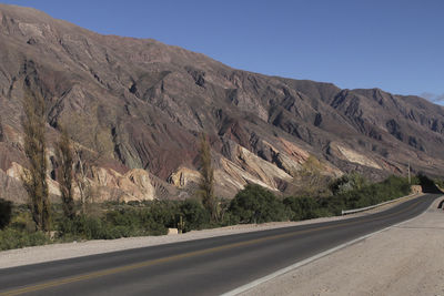 Country road with mountains in background