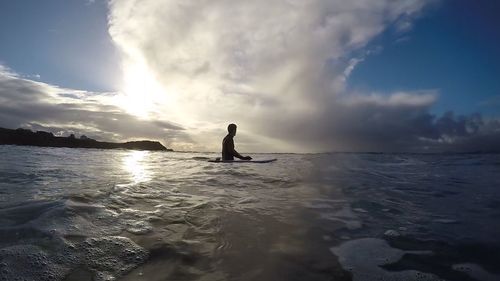 Man on sea against sky