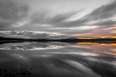 Scenic view of dramatic sky over sea during sunset