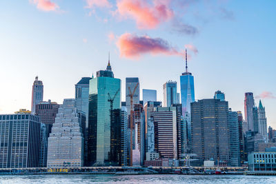 View of skyscrapers against cloudy sky