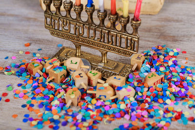 Close-up of colorful candles on table during hanukkah