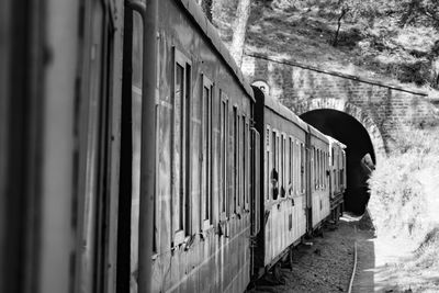 Toy train moving on mountain slopes, beautiful view, one side mountain, one side valley moving