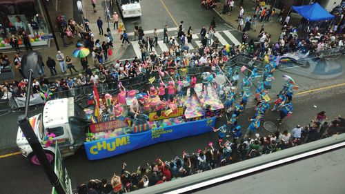 High angle view of people walking on road in city