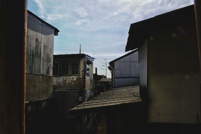 Buildings in town against sky
