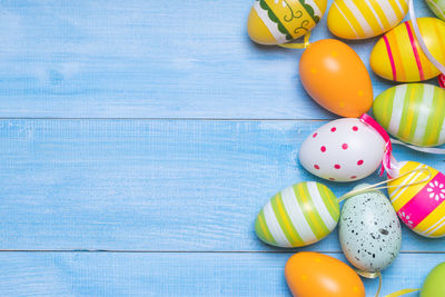 High angle view of multi colored eggs on table