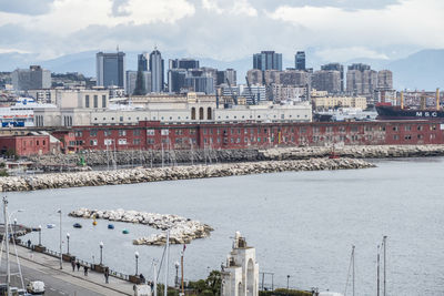 Panoramic view of buildings and river against sky