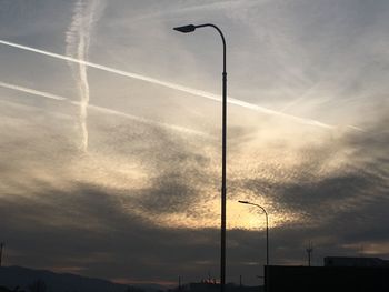 Low angle view of street light against sky