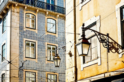 Lanterns mounted on wall of building