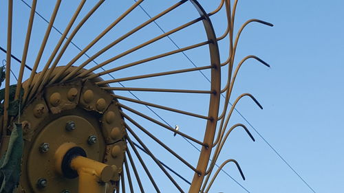 Low angle view of metal structure against sky