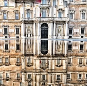 Reflection of historic building in canal