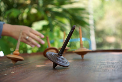 Close-up of woman holding umbrella on table