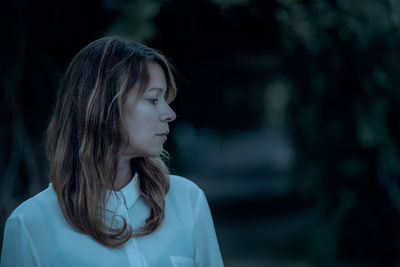 Portrait of a young woman looking away