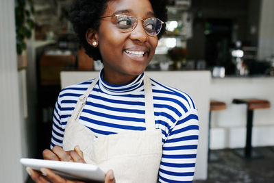 Portrait of smiling young woman