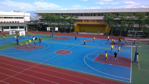 High angle view of people playing on basketball court